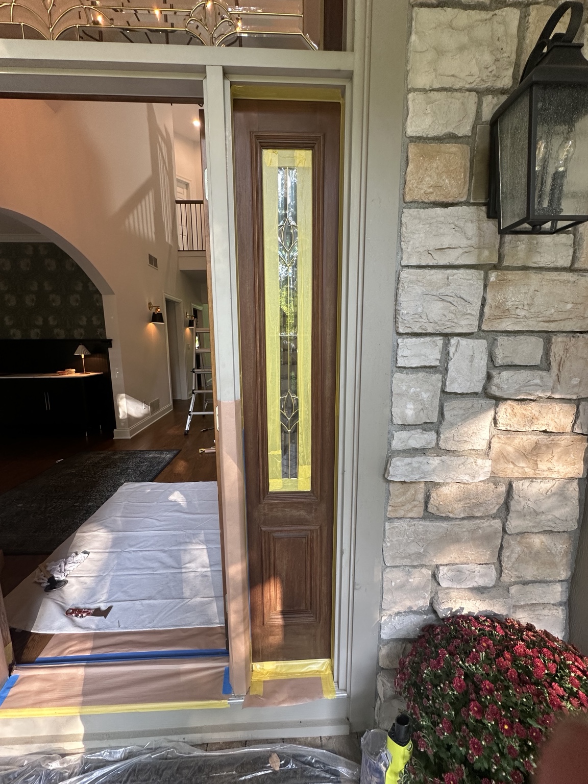 Entryway with glass and flooring carefully masked